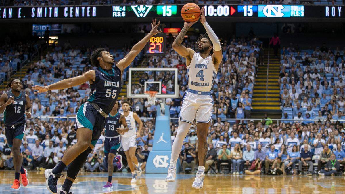 North Carolina’s R.J. Davis (4) launches a three-point shot during the first half against UNC Wilmington’s Donovan Newby (55) on Monday, November 7, 2022 at the Smith Center in Chapel Hill, N.C.
