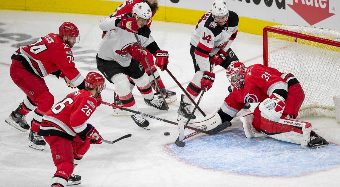 Carolina Hurricanes goalie Frederik Andersen (31) stops a scoring attempt by the New Jersey Devils Nathan Bastian (14) in the third period during Game 1 of their second round Stanley Cup playoff series on Wednesday, May 3, 2023 at PNC Arena in Raleigh, N.C.