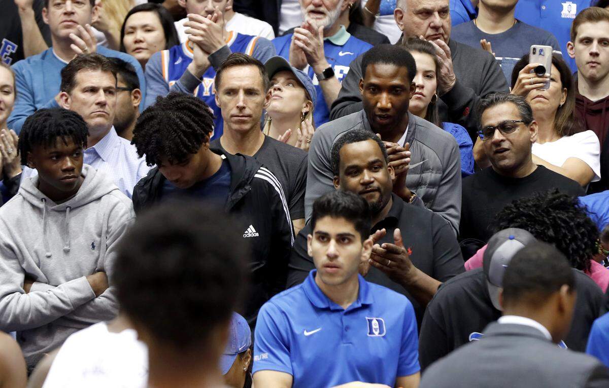 Basketball Hall of Fame guard Steve Nash, center left, and Rowan Barrett, RJ Barrett’s dad, watch during the team’s introductions before Duke’s game against Miami at Cameron Indoor Stadium in Durham, N.C., Saturday, March 2, 2019.