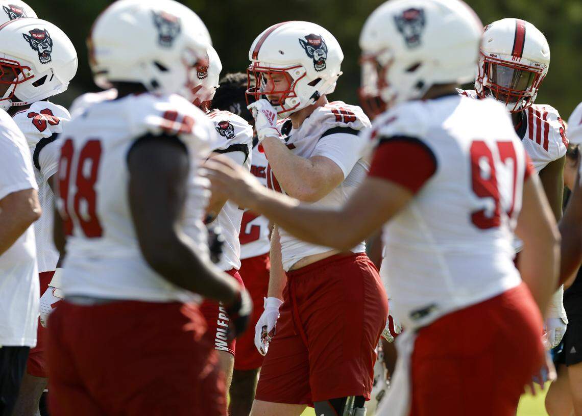 N.C. State linebacker Caden Fordham, center, prepares to run a drill during the Wolfpack’s first fall practice on July 30, 2025.