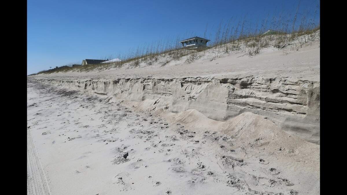 A cliff has formed along Emerald Isle, resulting in a dangerous 6-foot drop off along the Crystal Coast, photos show. 