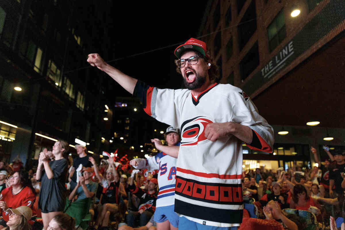 Daniel Jezioranski cheered in the third quarter of game 6 between the Carolina Hurricanes and Vegas Golden Knights during the Stanley Cup finals watch party at Smoky Hollow on June 14, 2026, in Raleigh, North Carolina. The Hurricanes last won the Stanley Cup in 2006.