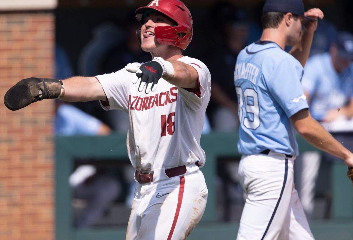 Arkansas Chris Lanzilli (18) scores on a double by Jalen Battles to give the Razorbacks a 1-0 lead over North Carolina in the fourth inning during game two of their NCAA Super Regional series on Sunday, June 12, 2022 at Boshamer Stadium in Chapel Hill, N.C.