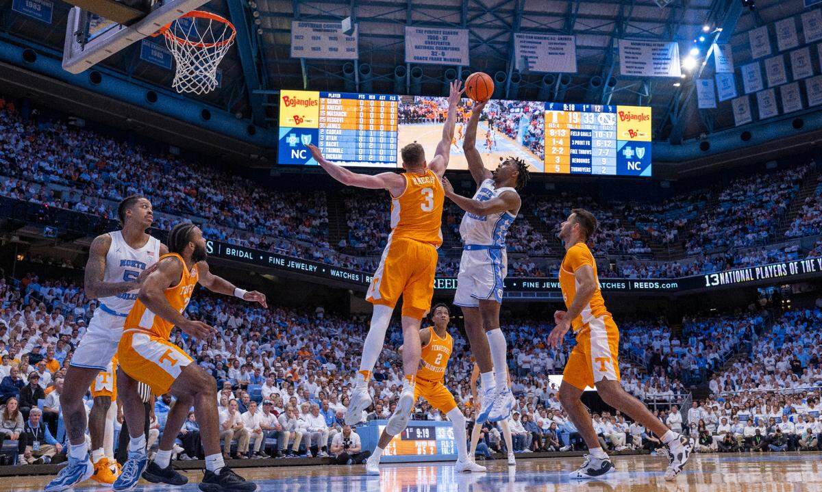 North Carolina’s Harrison Ingram (55) puts up a shot against Tennessee’s Dalton Knecht (3) to give the Tar Heels’ a 35-19 lead in the first half on Wednesday, November 29, 2023 at the Smith Center in. Chapel Hill, N.C.