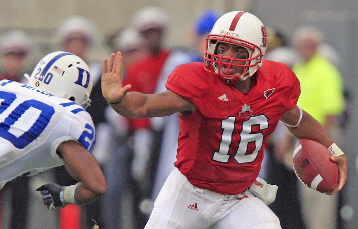 In this 2009 file photo, N.C. State’s Russell Wilson (16) tries to stiff arm Duke’s Lee Butler (20) during the Blue Devils’ victory Carter-Finley Stadium on Oct.10, 2009.