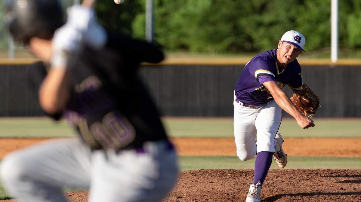 Corinth Holders’ Tyler Stufano, right, pitches to Holly Springs’ Patrick Trease, left, during a high school baseball game in Wendell, N.C., Tuesday, May 21, 2019.