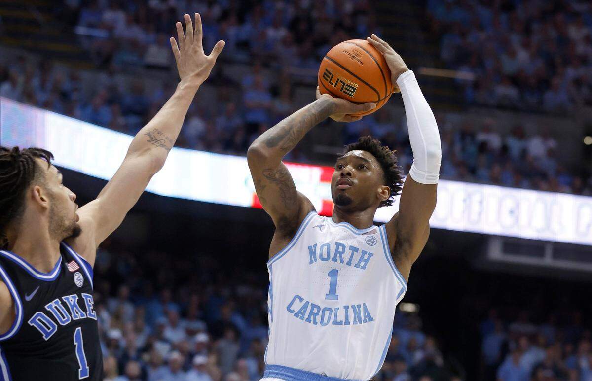 North Carolina’s Leaky Black (1) shoots as Duke’s Dereck Lively II (1) defends during the first half of UNC’s game against Duke at the Smith Center in Chapel Hill, N.C., Saturday, March 4, 2023.