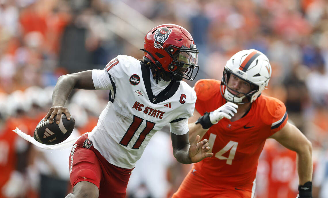 NC State football opens the season against Virginia. See photos from Week 0 game