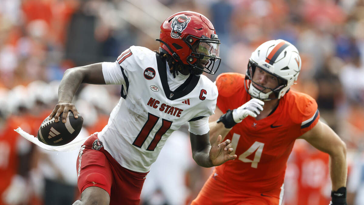 NC State football opens the season against Virginia. See photos from Week 0 game