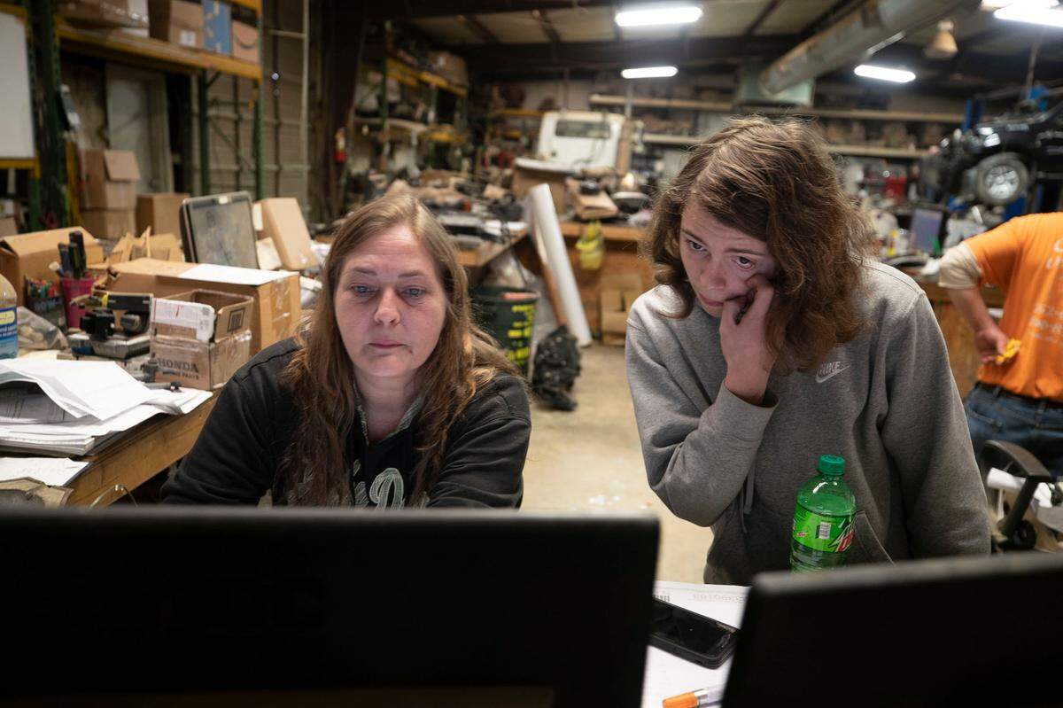 Warren County High School student Rocky Carter takes a break from his virtual classes to talk with him mom Clancy Carter at her workplace, CJ Iron & Metal near Macon, NC on Tuesday, February, 2, 2021. Carter utilizes the high speed internet connection at the workplace because his wi-fi hot spot does not perform well at his rural home. 