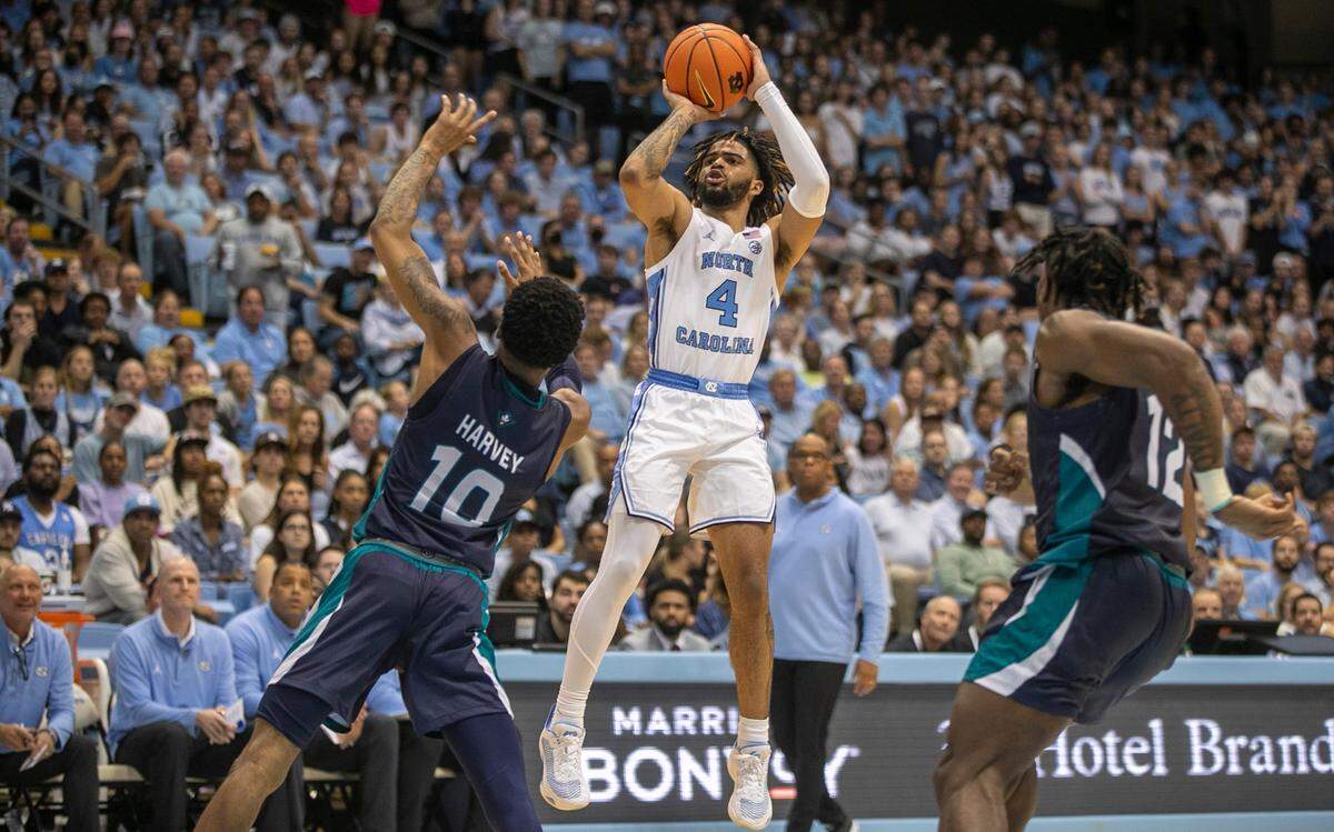 North Carolina’s R.J. Davis (4) launches a shot over UNC Wilmington’s Jamahri Harvey (10) in the second half on Monday, November 7, 2022 at the Smith Center in Chapel Hill, N.C.