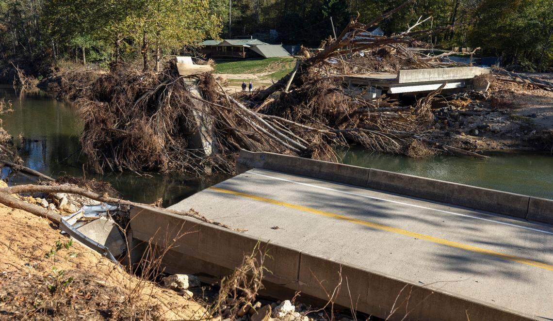 A bridge on Blue Rock Road, near Celo, N.C., that crosses the South Toe River, was washed into the river during historic flooding in the wake of Hurricane Helene three weeks ago. Photographed on Thursday, October 17, 2024.