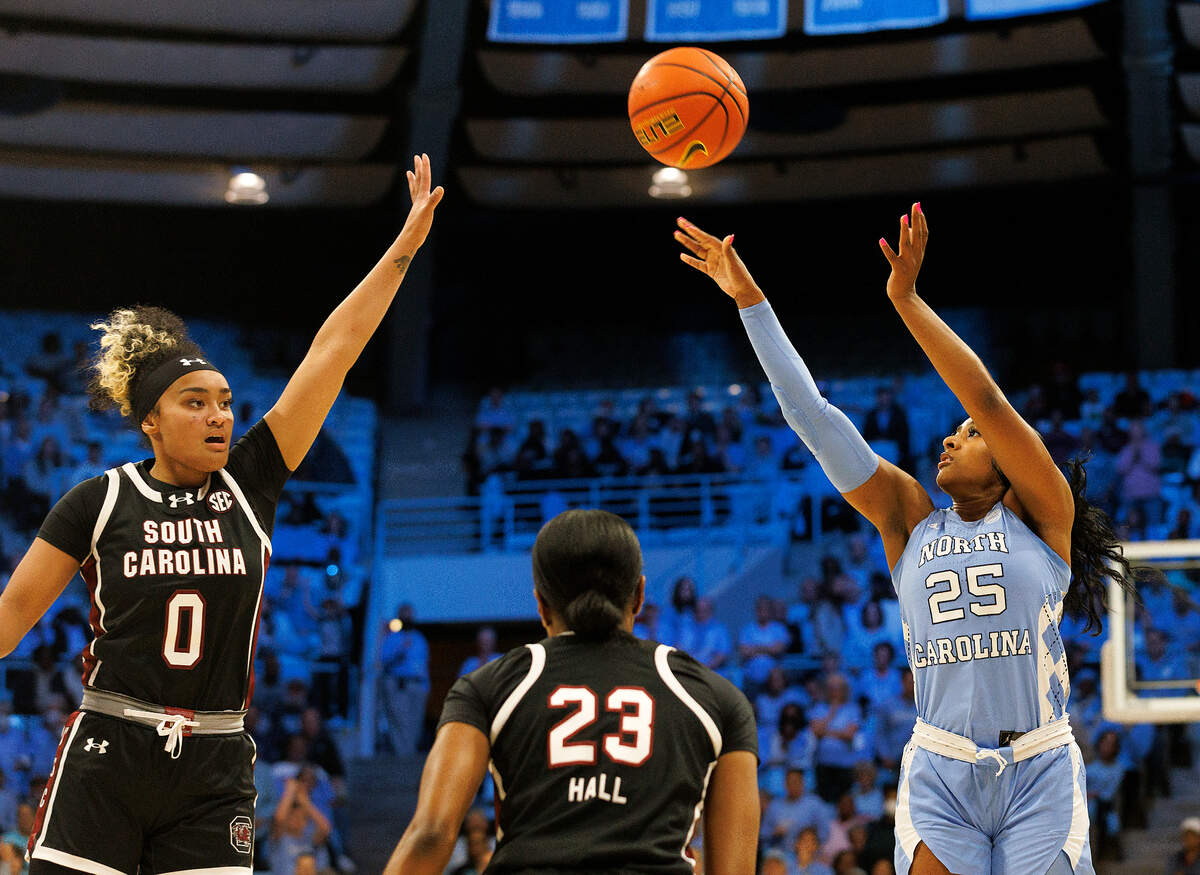 North Carolina’s Deja Kelly shoots over South Carolina’s Te-Hina Paopao and Bree Hall during the first half of the Tar Heels’ game on Thursday, Nov. 30, 2023, at Carmichael Arena in Chapel Hill, N.C.