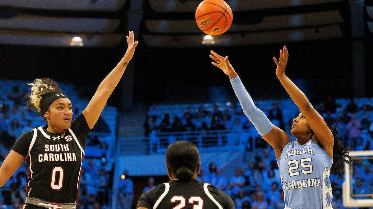 North Carolina’s Deja Kelly shoots over South Carolina’s Te-Hina Paopao and Bree Hall during the first half of the Tar Heels’ game on Thursday, Nov. 30, 2023, at Carmichael Arena in Chapel Hill, N.C.