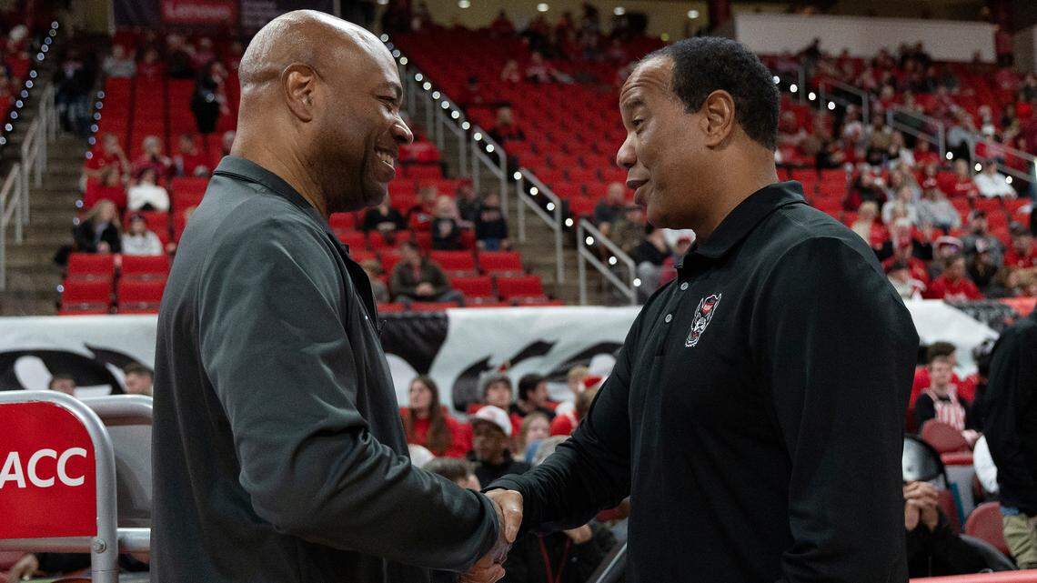 N.C. State head coach Kevin Keatts greets Florida State head coach Leonard Hamilton prior to the Wolfpack’s game against the Seminoles on Saturday, Dec. 7, 2024, at Lenovo Center in Raleigh, N.C. 
