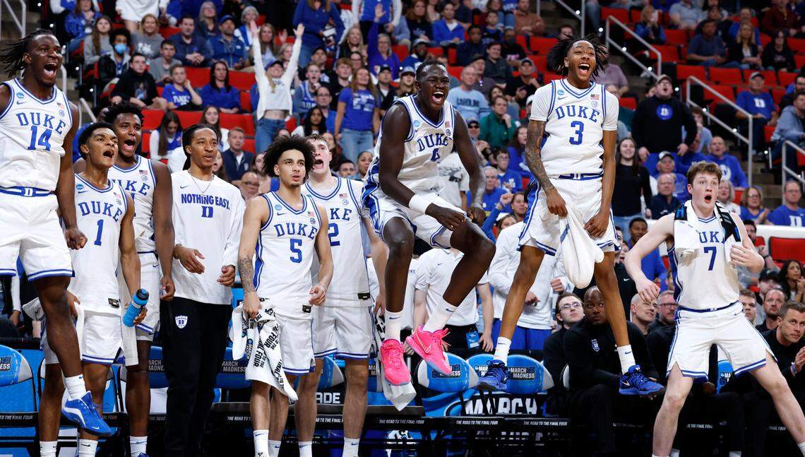 The Duke bench celebrates after Darren Harris slammed in two during the second half of Duke’s 93-49 victory over Mount St. Mary’s in the first round of the 2025 NCAA Men’s Basketball Tournament at the Lenovo Center in Raleigh, N.C., Friday, March 21, 2025.