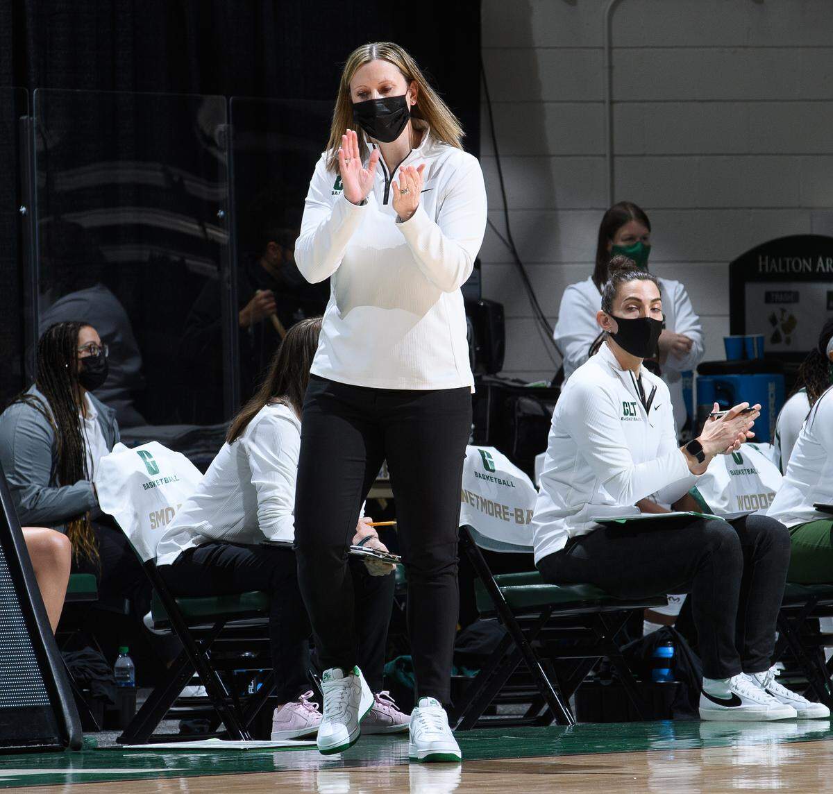 Cara Consuegra claps for her team during a game.