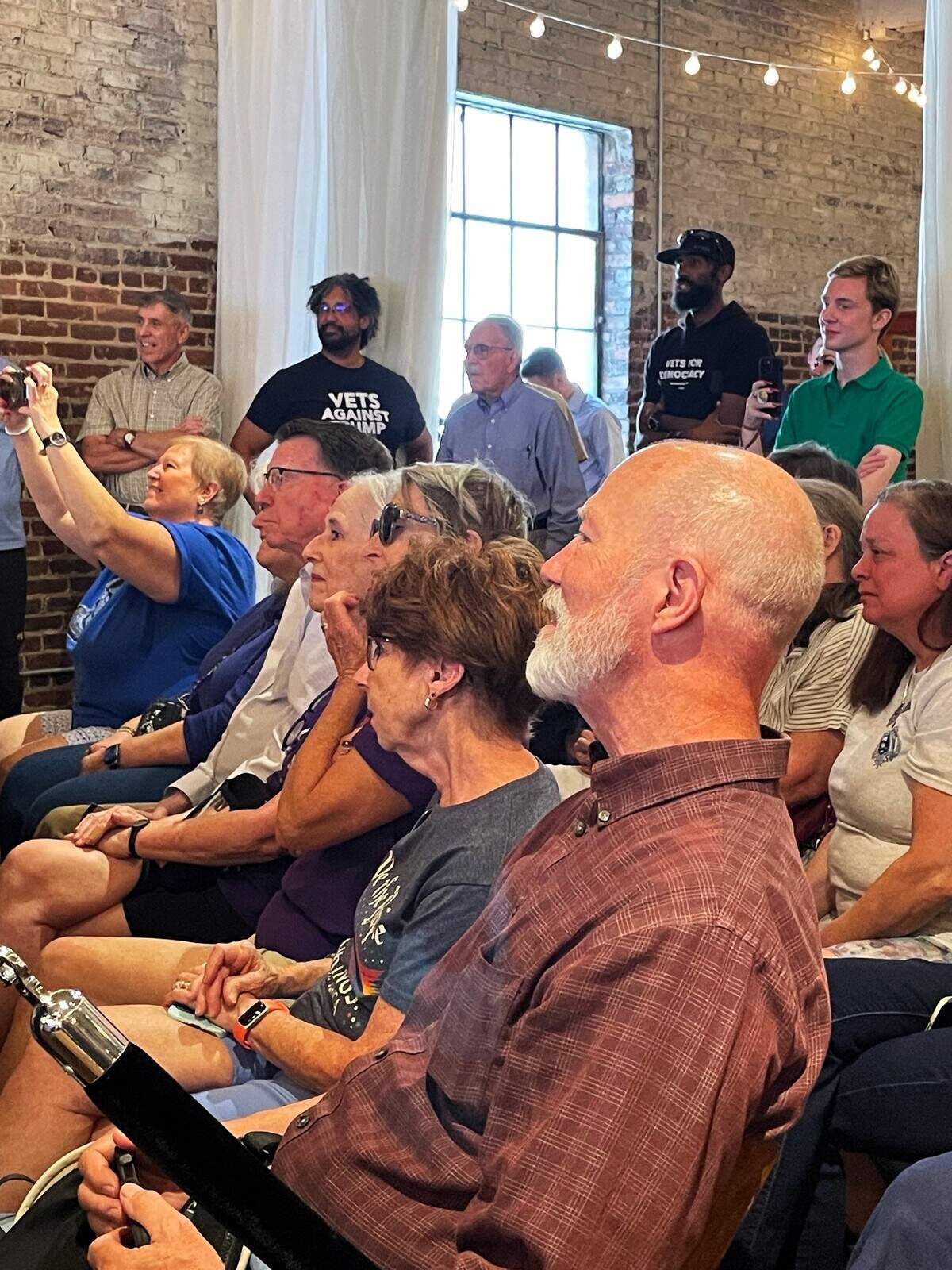 Arizona Sen. Mark Kelly, a Democrat, found a welcoming crowd when he stopped in downtown Raleigh on Sunday, Aug. 31, 2025, to talk about federal cuts to the Department of Veterans Affairs and other Trump Administration policies.