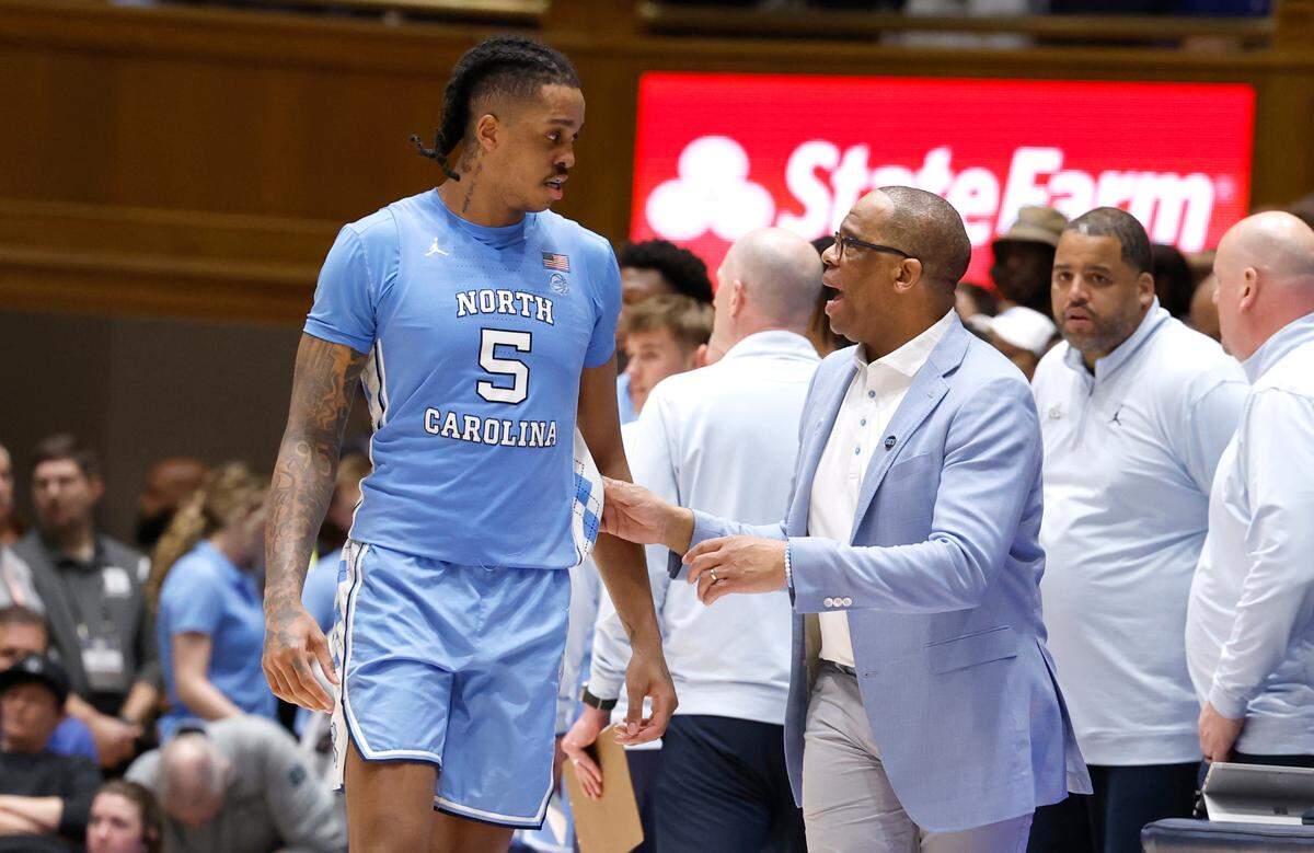 North Carolina’s head coach Hubert Davis talks with Armando Bacot (5) during the second half of UNC’s 84-79 victory over Duke at Cameron Indoor Stadium in Durham, N.C., Saturday, March 9, 2024.