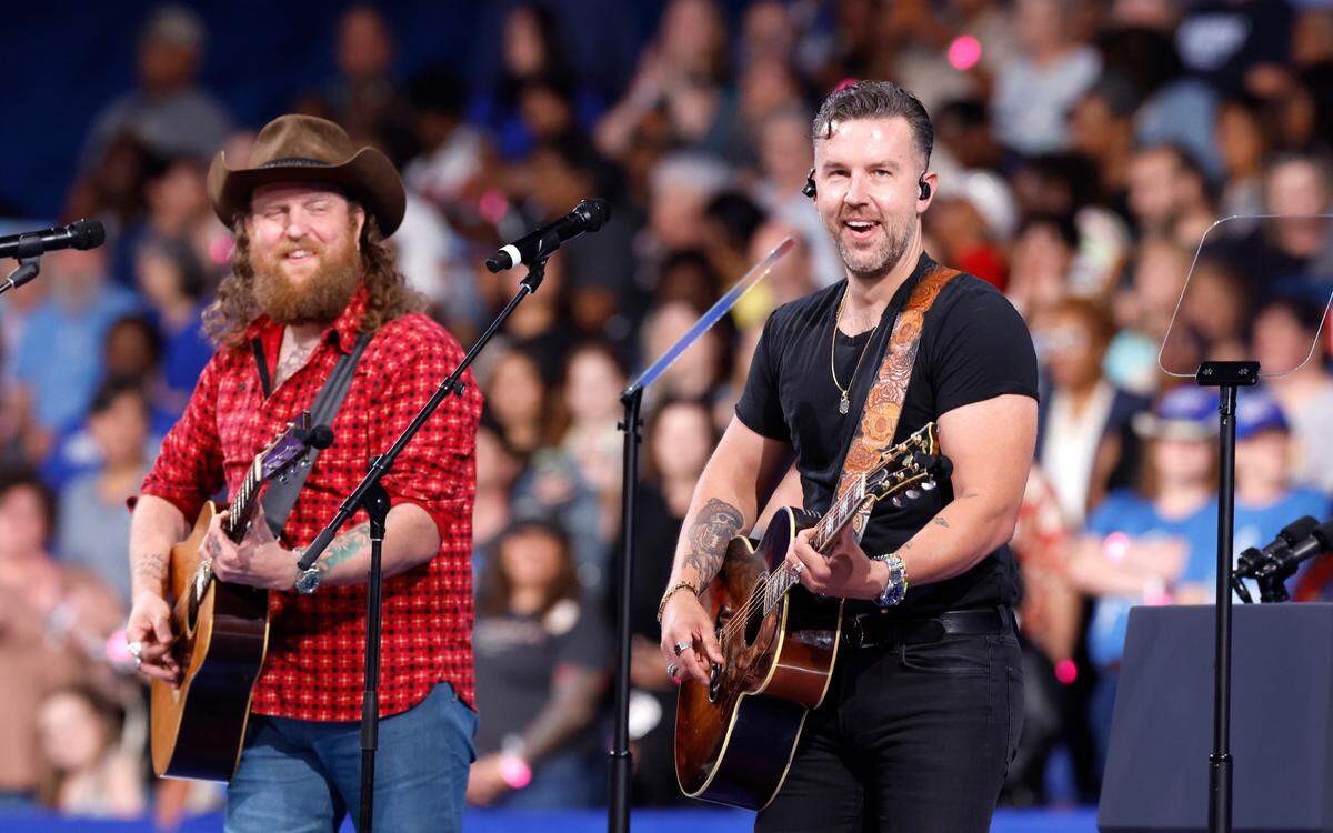 The Brothers Osborne play during a rally for Vice President and democratic nominee for president Kamala Harris at the Greensboro Coliseum in Greensboro, N.C., Thursday, Sept. 12, 2024.