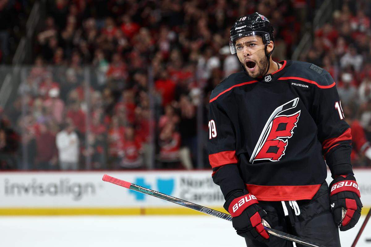 K'Andre Miller of the Carolina Hurricanes celebrates following a goal scored during the third period of the game against the New Jersey Devils at Lenovo Center on Oct. 9, 2025 in Raleigh, North Carolina.