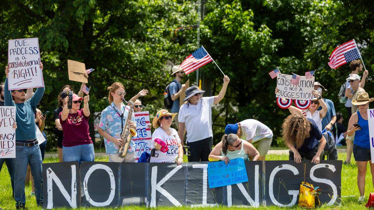 More than 1500 demonstrators lined Capital Boulevard to protest the policies and tactics of the of President Donald Trump on Saturday, June 14, 2025 near Triangle Town Center in Raleigh. The Raleigh “No Kings” rally was one of dozens across North Carolina and hundreds nationwide on what organizers called a nationwide day of defiance against the Trump administration.