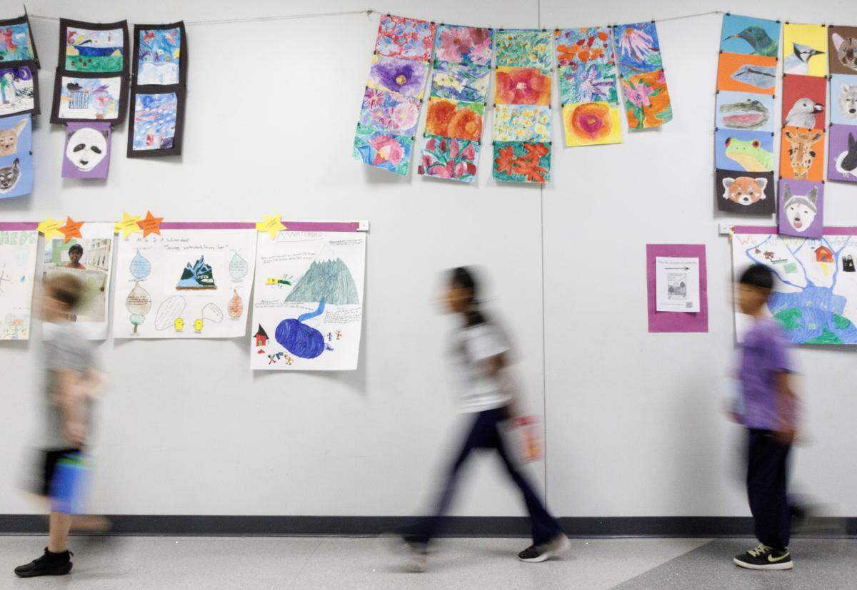 Students walk through a hallway at Apex Friendship Elementary School on Tuesday, May 5, 2026, in Apex, N.C.