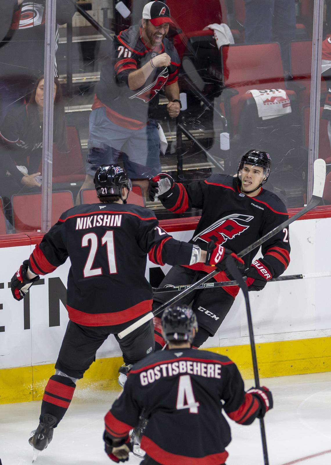 Carolina Hurricanes center Logan Stankoven celebrates with Alexander Nikishin (21) after scoring to take a 1-0 lead over the Ottawa Senators in the second period on Saturday, April 18, 2026, during the first round of the Stanley Cup playoffs at Lenovo Center in Raleigh, North Carolina. 