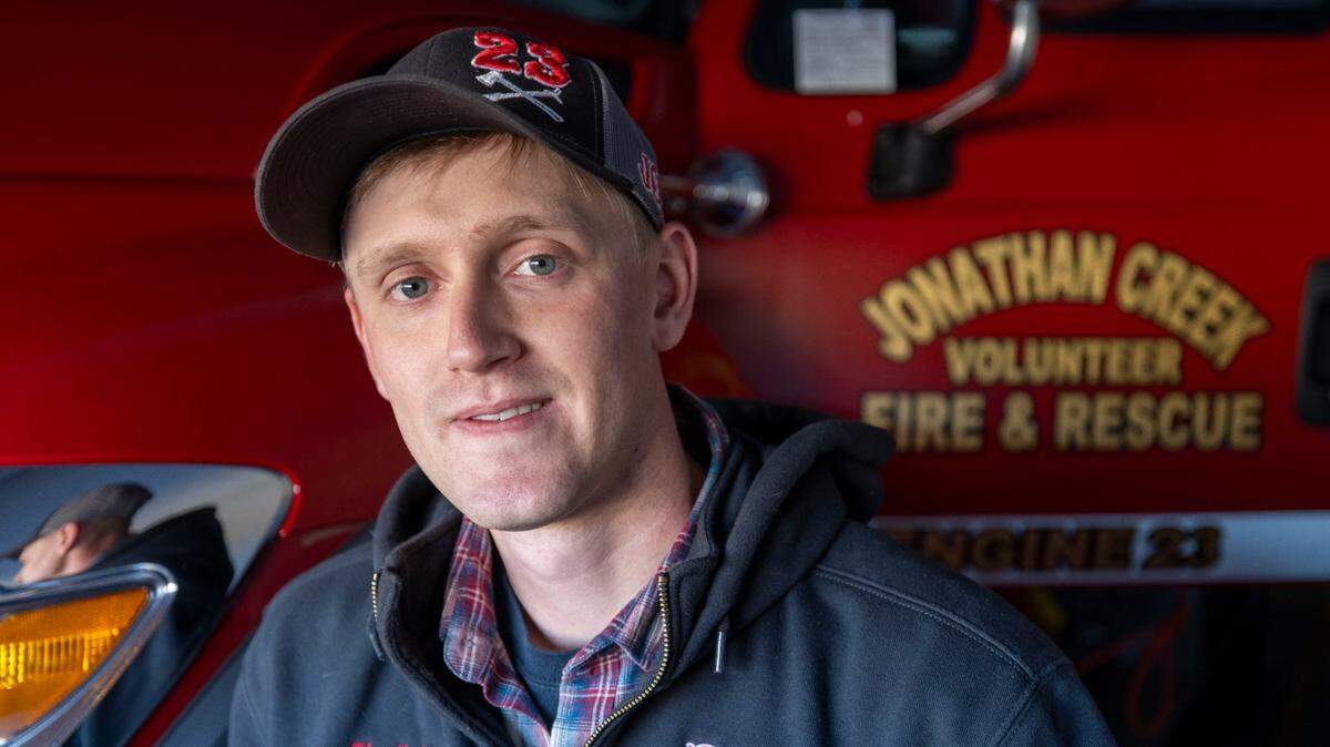 Daniel Ross a member of the Jonathan Creek Fire Department, poses for a portrait on Friday, December 6, in Waynesville, N.C. Ross is also an engineer with the NC Department of Transportation working to rebuild I-40 in the Pigeon River Gorge.
