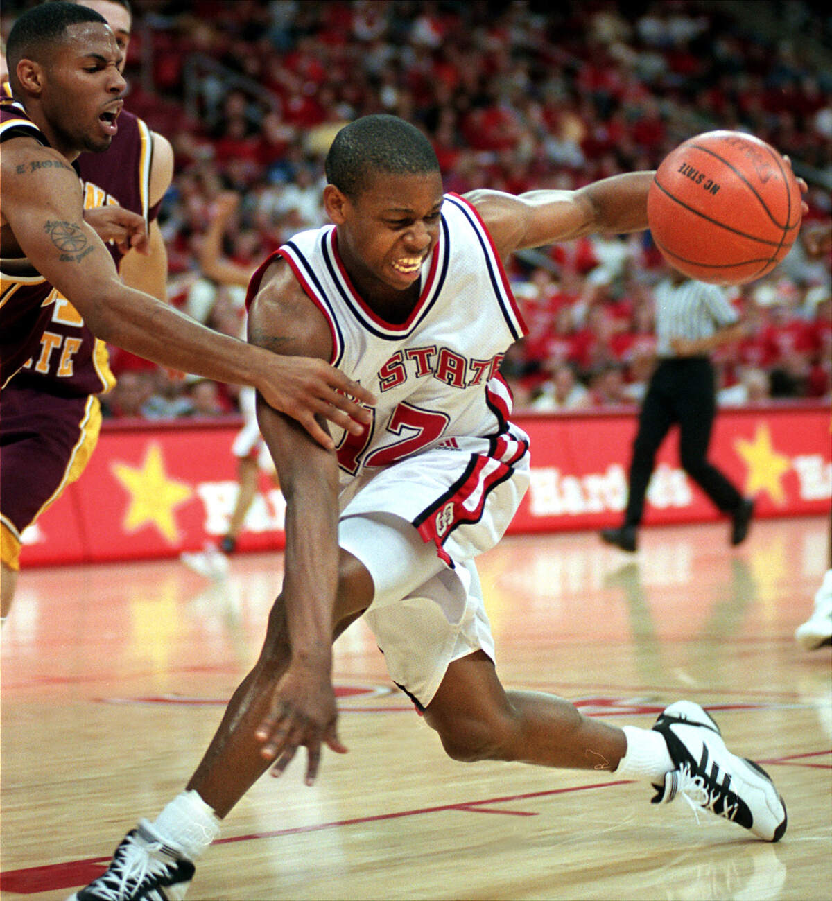 N.C. State's Justin Gainey fights for control of the ball with Arizona State's Eddie House (5) in the second half in 2000.