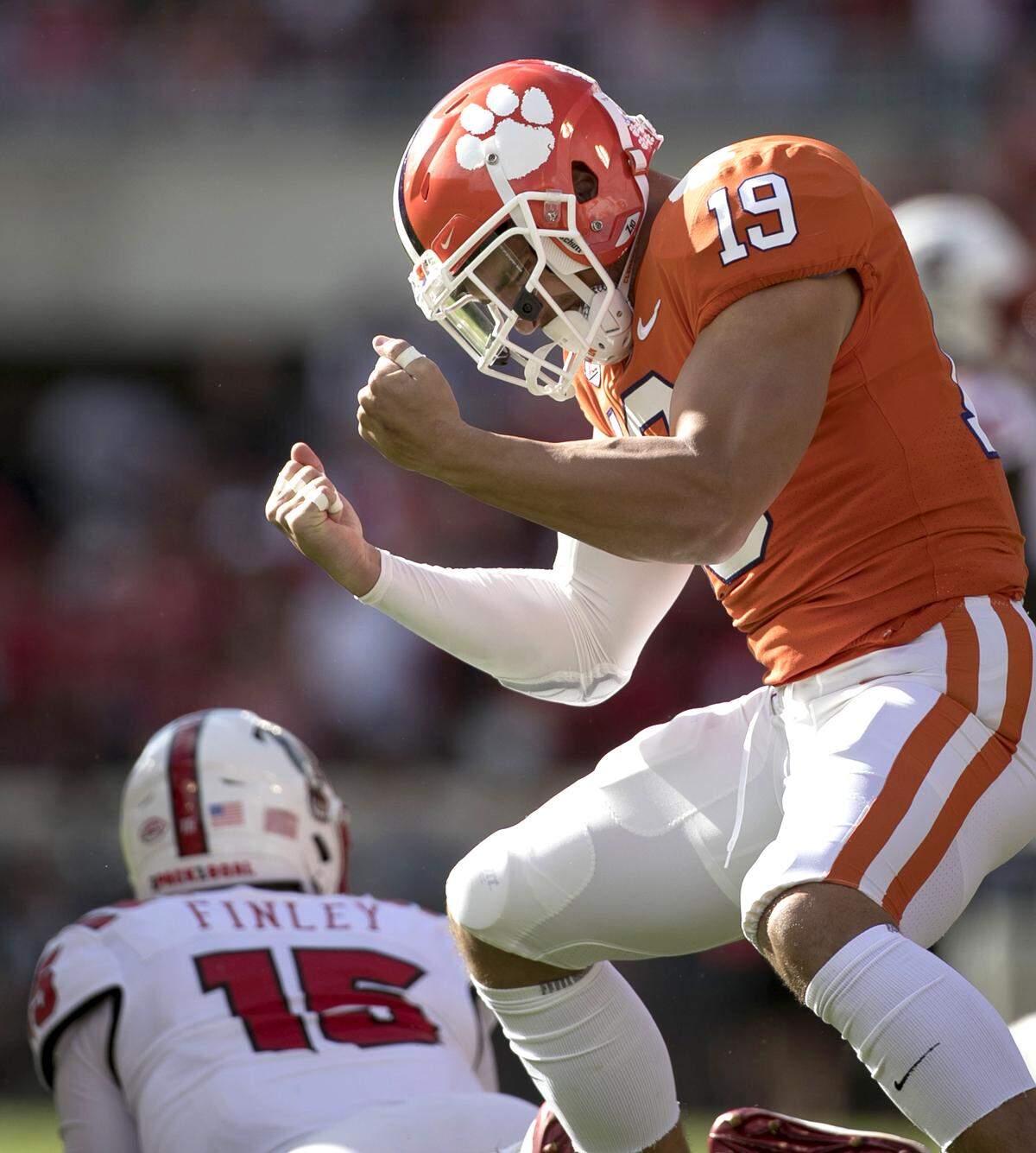 Clemson’s Tanner Muse (19) reacts after a sack of N.C. State quarterback Ryan Finley (15) for a loss of nine yards in the first quarter on Saturday, October 20, 2018 at Memorial Stadium in Clemson, S.C.