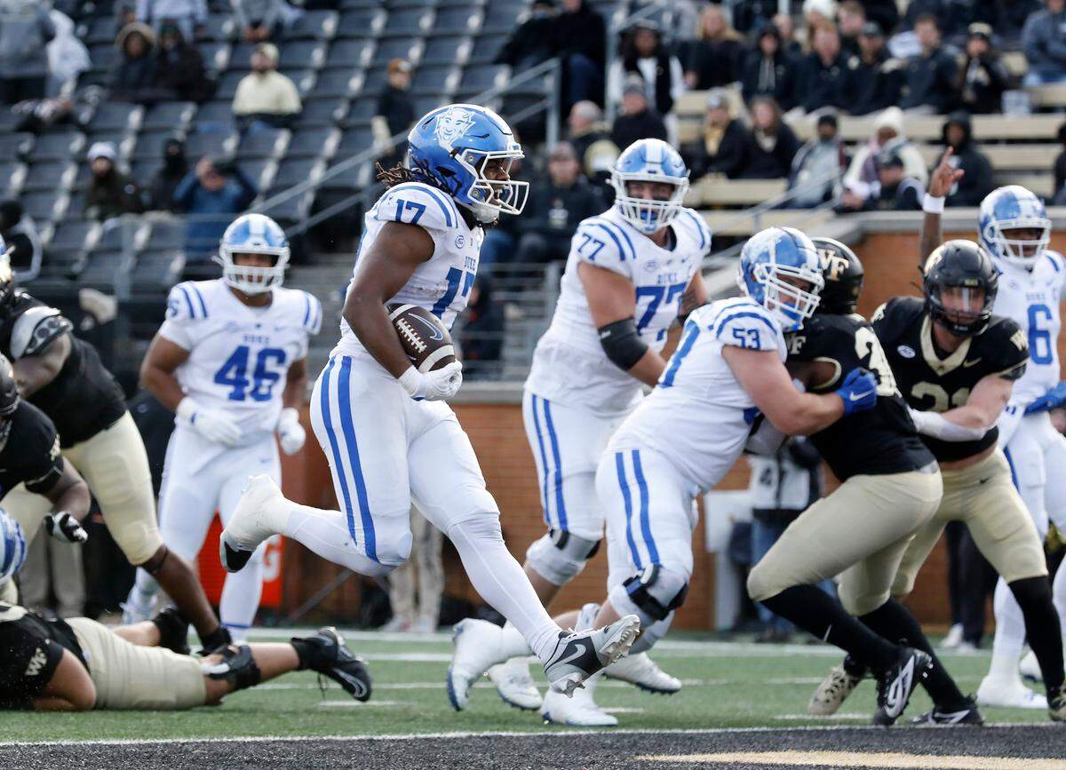 Duke’s Star Thomas runs the ball into the end zone for a touchdown during the second half of the Blue Devils’ 23-17 win at Allegacy Stadium on Saturday, Nov. 30, 2024, in Winston-Salem, N.C.