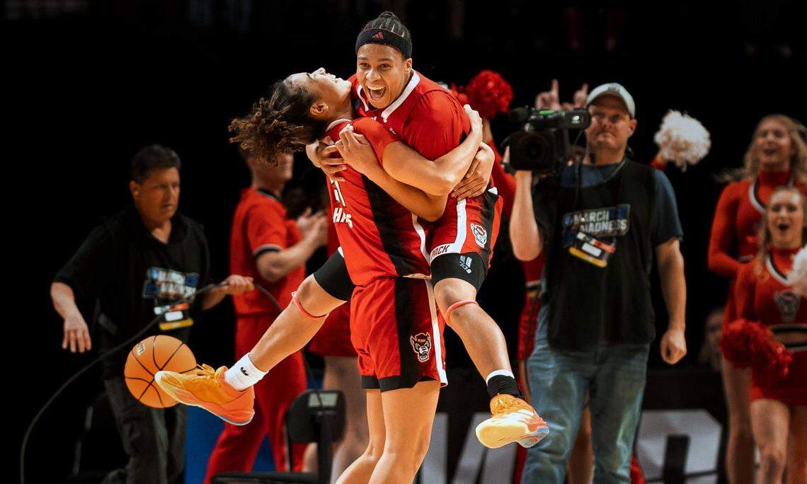 NC State’s Zoe Brooks leaps into the arms of Madison Hayes after defeating Stanford in their NCAA Sweet 16 game in Portland.