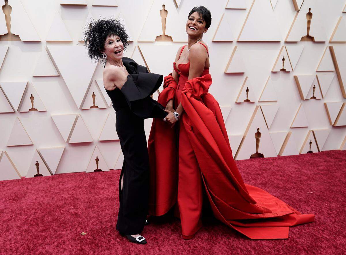 Rita Moreno, left, and Ariana DeBose arrive at the Oscars on Sunday, March 27, 2022, at the Dolby Theatre in Los Angeles. (AP Photo/Jae C. Hong)