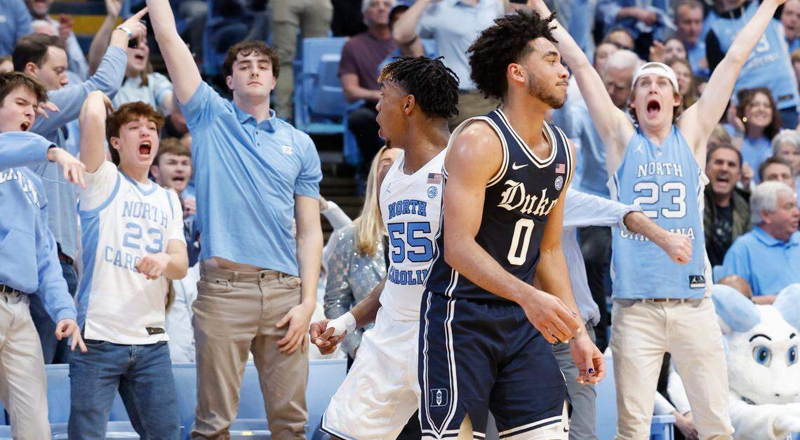 Fans react after North Carolina’s Harrison Ingram (55) hit a three-pointer during the first half of Duke’s game against UNC at the Smith Center in Chapel Hill, N.C., Saturday, Feb. 3, 2024. Duke’s Jared McCain (0) is to the right.