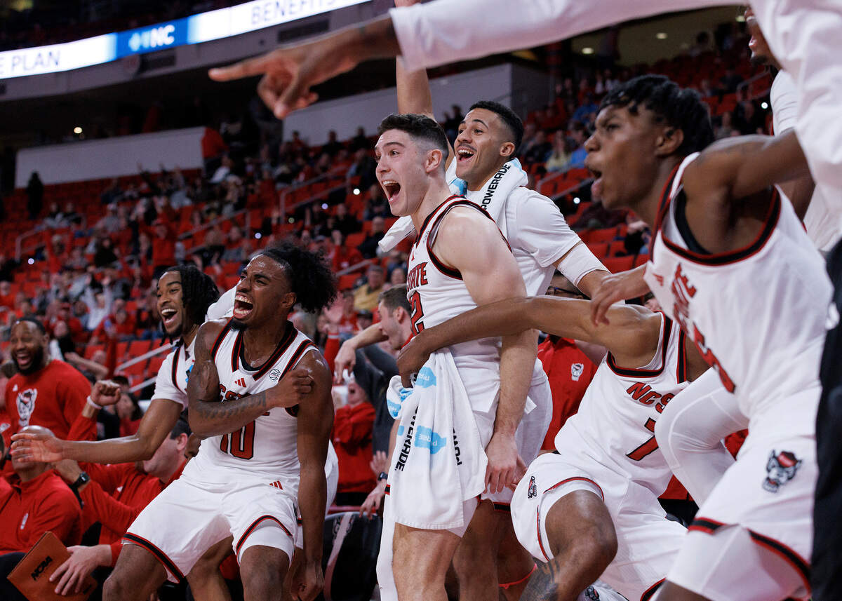 The N.C. State bench reacts in the closing minute of the Wolfpack’s 84-61 win over William & Mary at Lenovo Center on Friday, Nov. 22, 2024, in Raleigh, N.C.