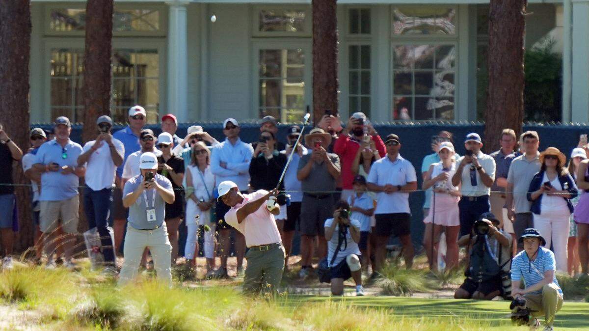 Jun 11, 2024; Pinehurst, North Carolina, USA; Tiger Woods plays his shot from the seventh fairway during a practice round for the U.S. Open golf tournament at Pinehurst No. 2. Mandatory Credit: Katie Goodale-USA TODAY Sports