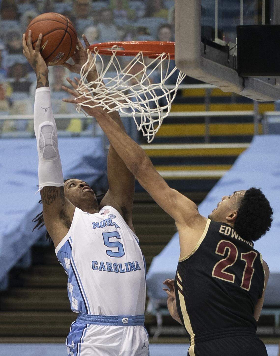 North Carolina’s Armando Bacot (5) dunks over College of Charleston’s Lorenzo Edwards (21) during the first half on Wednesday, November 25, 2020 at the Smith Center in Chapel Hill, N.C.