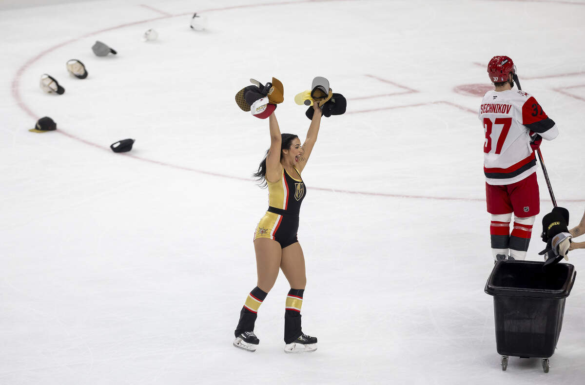 The Vegas Knight Guard remove hats from the ice after a hat-trick by Vegas right wing Mitch Marner (93) to take a 4-0 lead over the Carolina Hurricanes in Game 3 of the Stanley Cup Final, on Saturday, June 6, 2026 at T-Mobile Arena in Las Vegas, NV.
