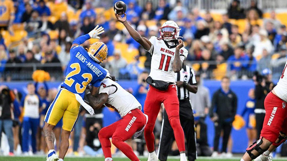 PITTSBURGH, PENNSYLVANIA - OCTOBER 25: CJ Bailey #11 of the NC State Wolfpack throws a pass during the third quarter against the Pittsburgh Panthers at Acrisure Stadium on October 25, 2025 in Pittsburgh, Pennsylvania. (Photo by Nick Cammett/Getty Images)