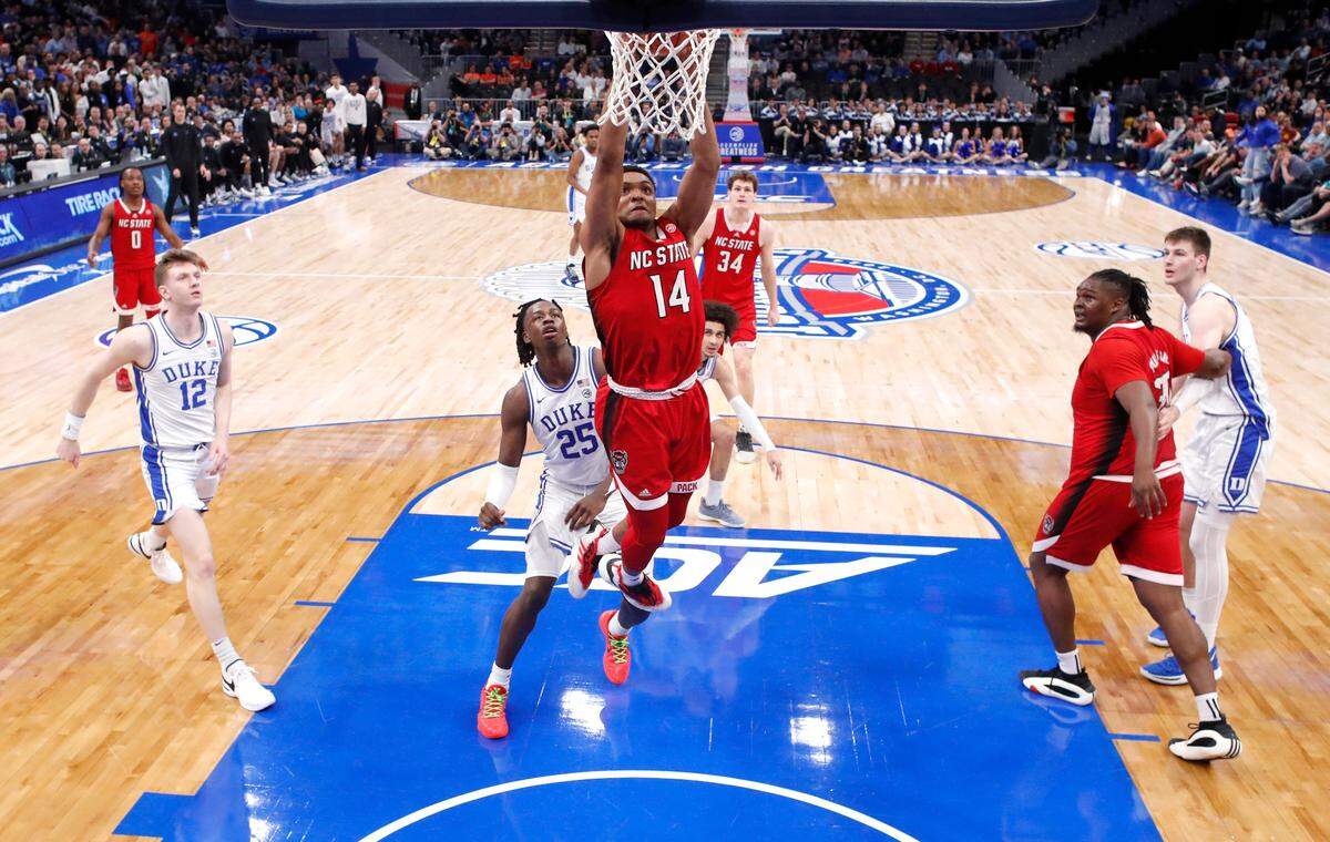 N.C. State’s Casey Morsell (14) slams in two during N.C. State’s 74-69 victory over Duke in the quarterfinal round of the 2024 ACC Men’s Basketball Tournament at Capital One Arena in Washington, D.C., Thursday, March 14, 2024.