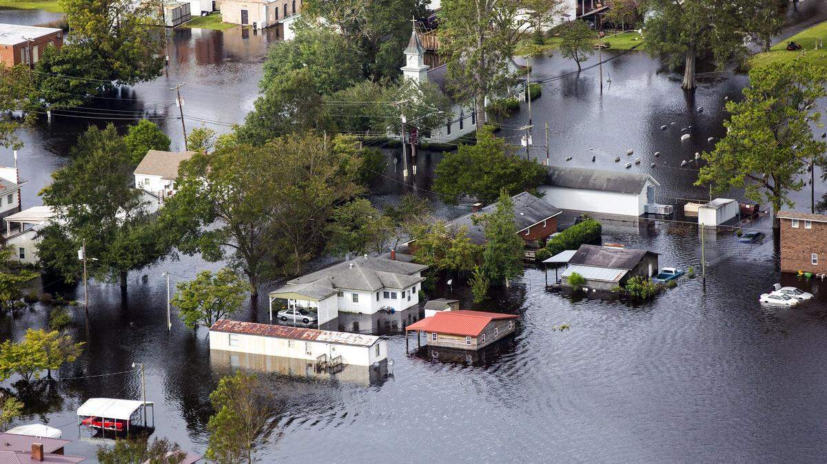 Three days after Hurricane Florence made landfall in Wilmington, NC, flood water still surrounds buildings in Trenton, NC, on Monday, Sept. 17, 2018.