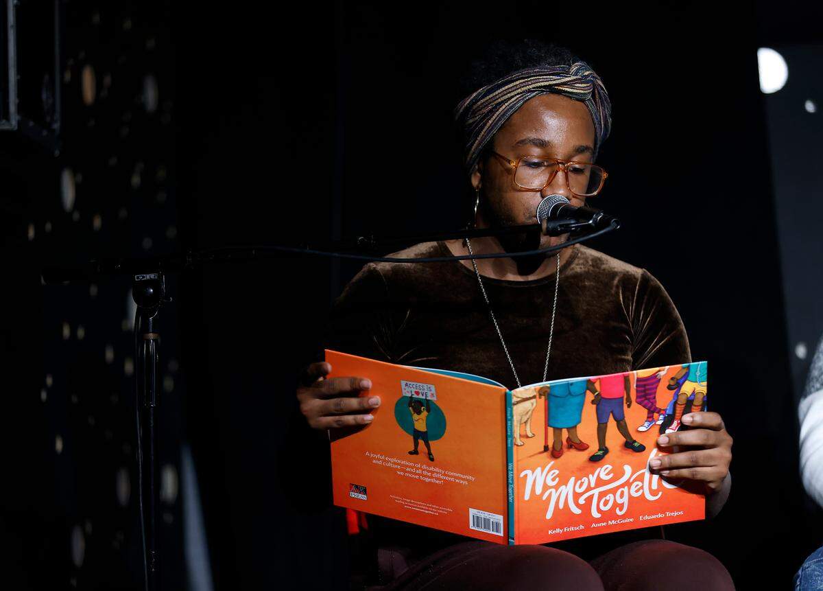 Stormie Daie reads a passage from a book entitled, “We Move Together” during a press conference held at the Pinhook on Thursday, Dec. 8, 2022, addressing the Dec. 3rd drag show in Southern Pines, N.C. and power outages in Moore County.
