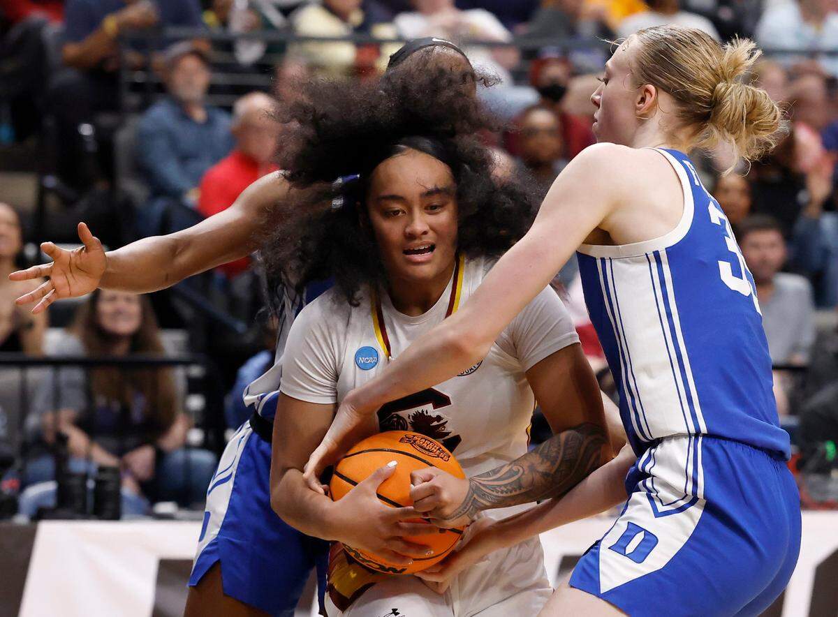 Duke’s Oluchi Okananwa and Toby Fournier pressure South Carolina’s Te-Hina Paopao during the second half of the Blue Devils’ 54-50 loss in the NCAA Tournament Elite Eight at Legacy Arena on Sunday, March 30, 2025, in Birmingham, Ala.