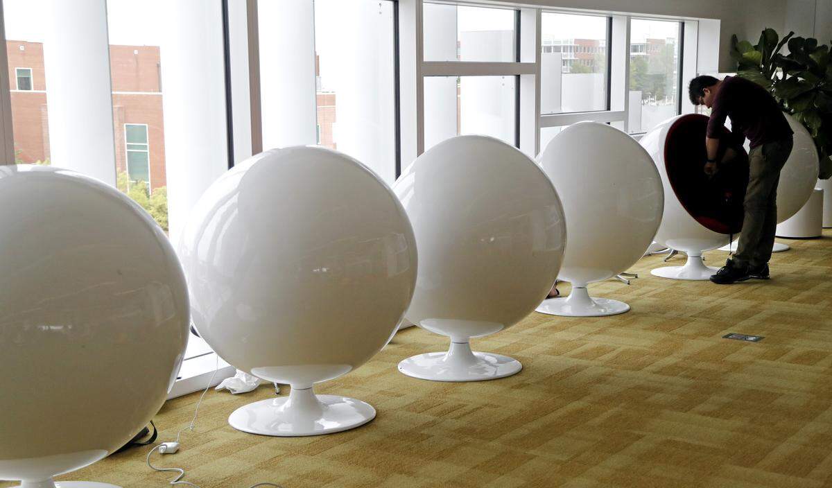 Shreyansh Kabrawala, an N.C. State graduate student from India studying management systems sets up to study in one of the ball-shaped chairs in the James B. Hunt Library on the N.C. State Centennial Campus in Raleigh, N.C. on April 18, 2017.  The library, which opened in January 2013, is known for its eclectic design, featuring bold colors and shapes, as well as a wide variety of furniture.