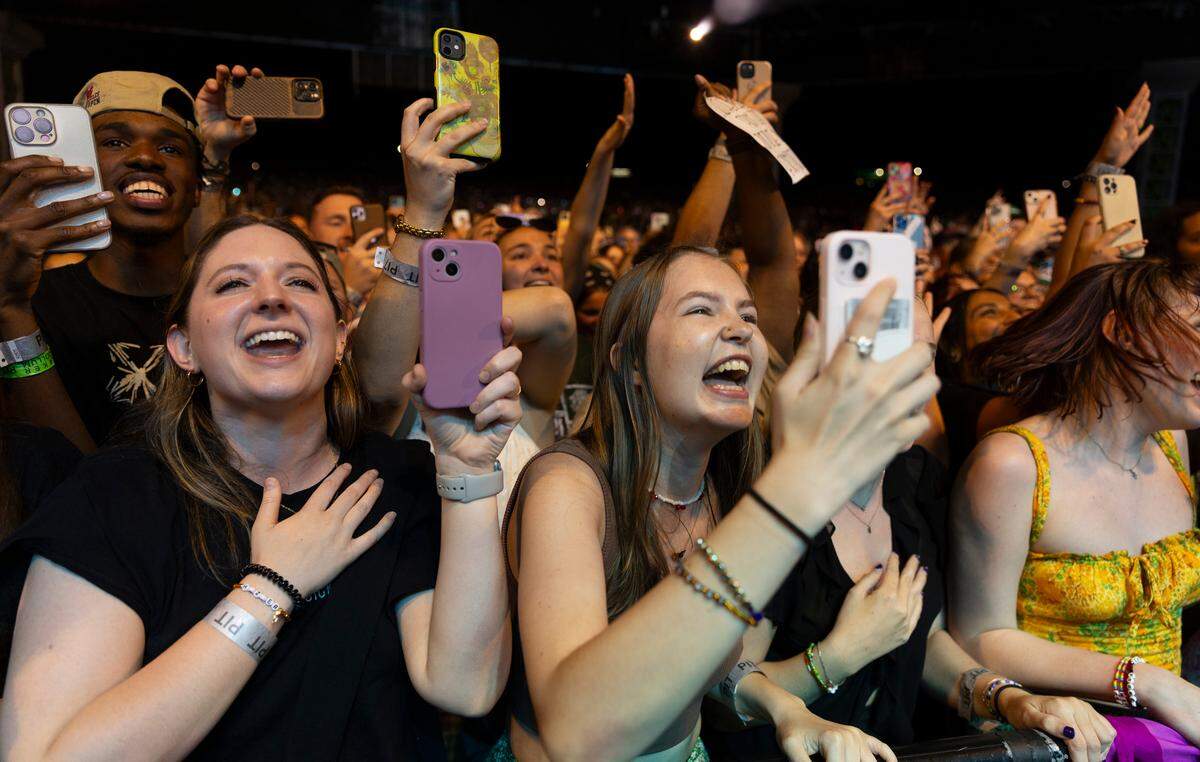 Fans react as Hozier performs in concert at Coastal Credit Union Music Park at Walnut Creek in Raleigh, N.C., Saturday night, April 20, 2024.