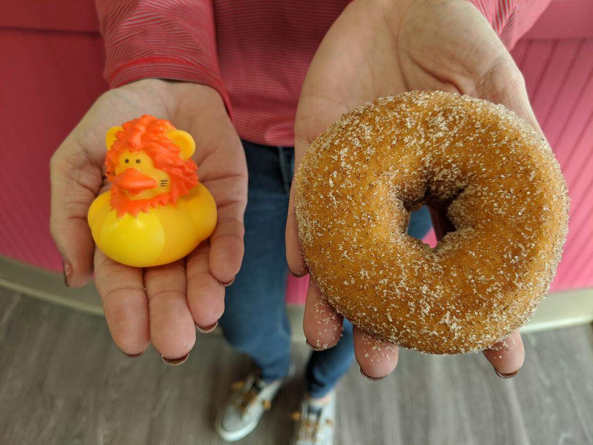 A duck and a Cinnaman Sugar doughnut at Duck Donuts.