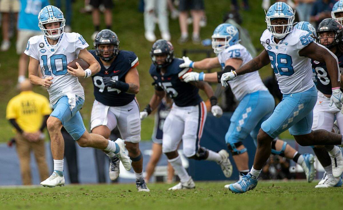 North Carolina quarterback Drake Maye (10) breaks open for a 21-yard gain in the third quarter on Saturday, November 5, 2022 at Scott Stadium in Charlottesville, Va. Maye rushed for 74 yards in the Tar Heels’ victory.