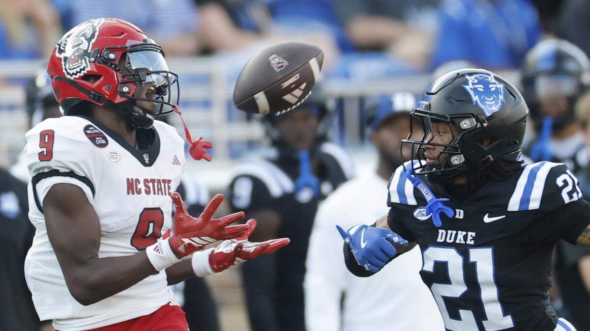 N.C. State wide receiver Terrell Anderson (9) pulls in the reception while being defended by Duke cornerback Landan Callahan (21) during the first half of N.C. State’s game against Duke at Wallace Wade Stadium in Durham, N.C., Sat. Sept. 20, 2025