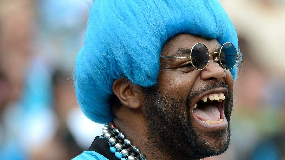 In this Charlotte Observer file photo, Carolina Panthers fan Greg “Catman” Good yells support to the Panthers at a 2012 game. Good died Friday, at age 62.